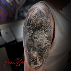 Realistic tattoo of a deer in black and white