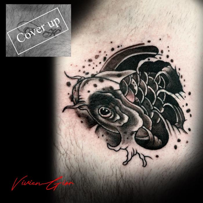 realistic tattoo coverup coverting text with a cute little fish swimming in the water