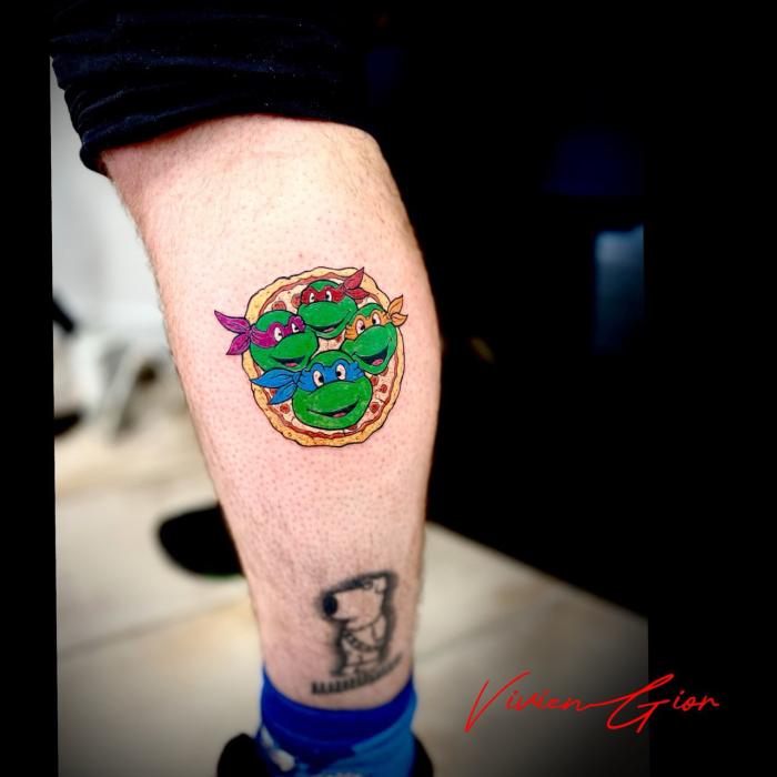  realistic tattoo of cartoon looking turtles from comics on calf
