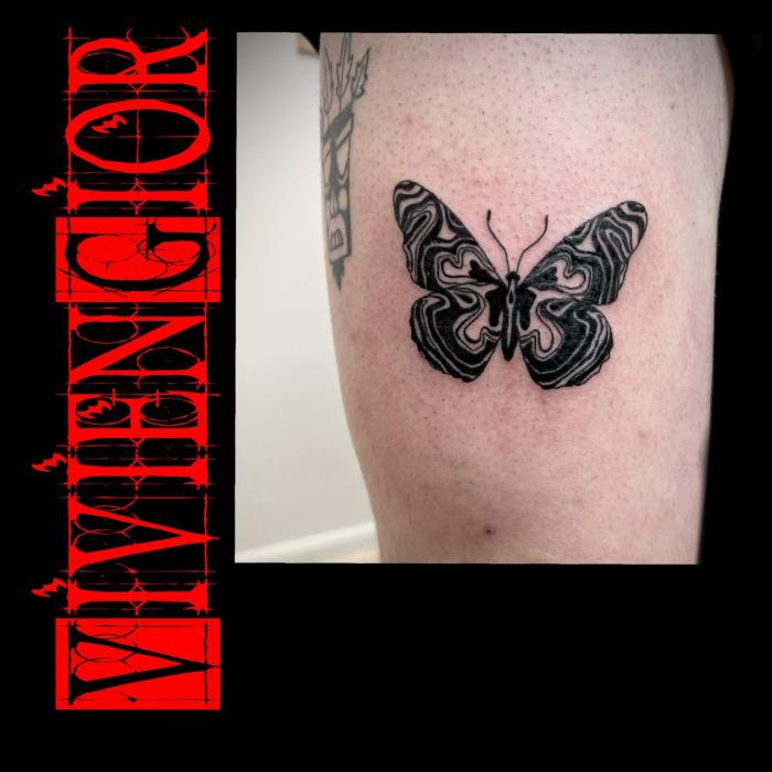  realistic tattoo of butterfly on hand of woman in realism