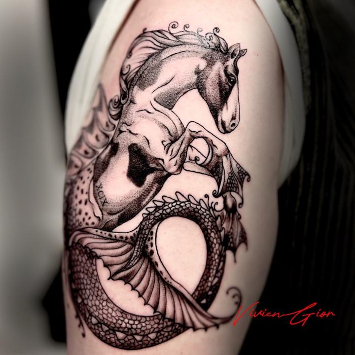  realistic tattoo of mystical horse on hand looking menancingly 