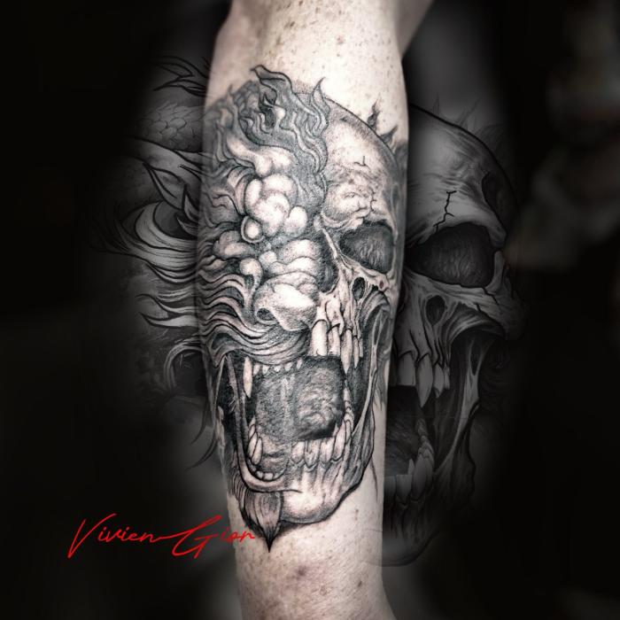  realistic tattoo of skull emerging from unknown predator on hand
