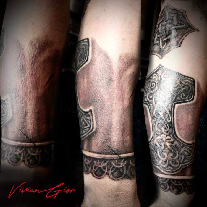  realistic tattoo in realism of ancient viking armor tattooed on hand