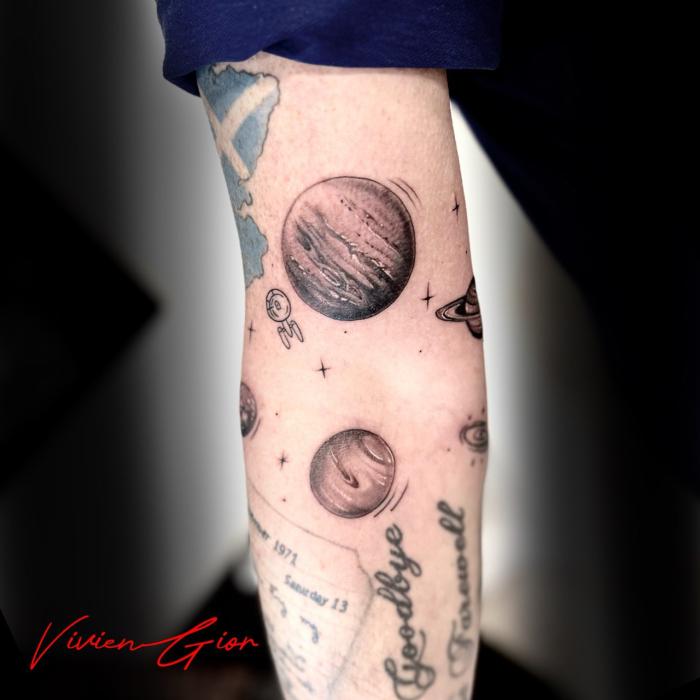  realistic Tattoo realism planet in space on hand 