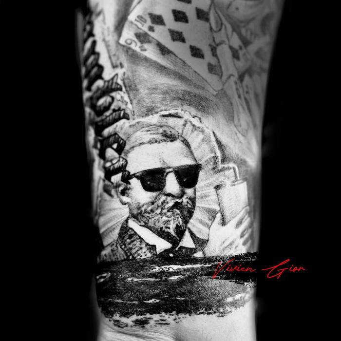 tattoo of an old man in galsses tattooed with some card on top of the picture and text  