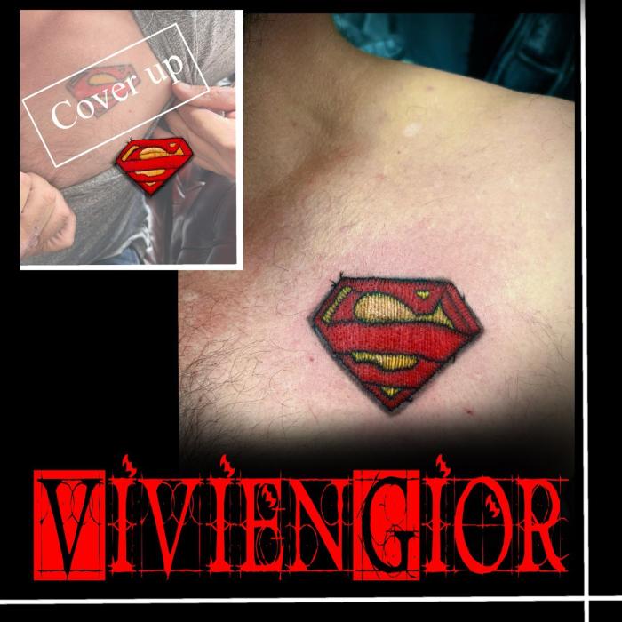  cover up of the superman tattoo on the shoulder near the chest 